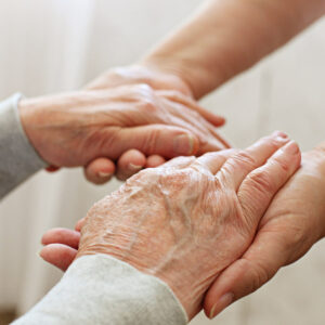 Sage Oak of Lake Charles | Senior holding hands with caregiver