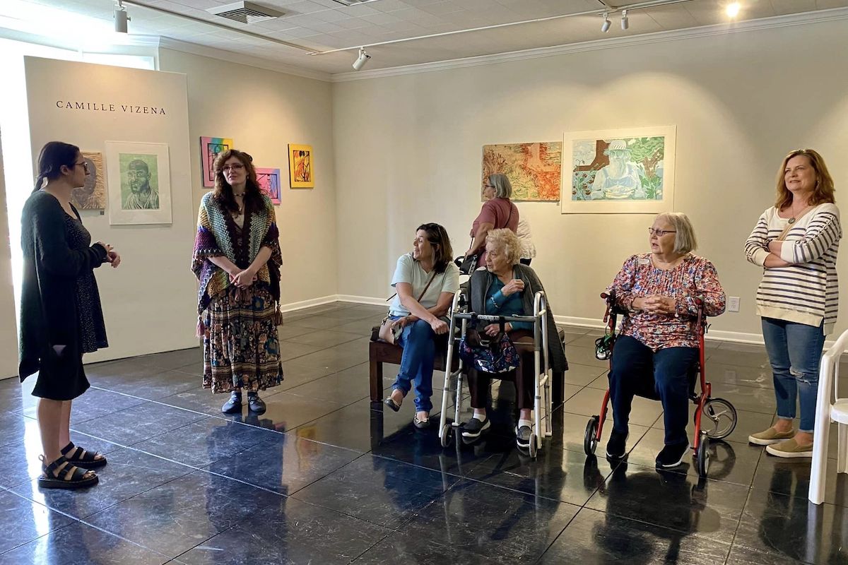 Sage Oak of Lake Charles | Residents of an assisted living community listening to a museum tour guide