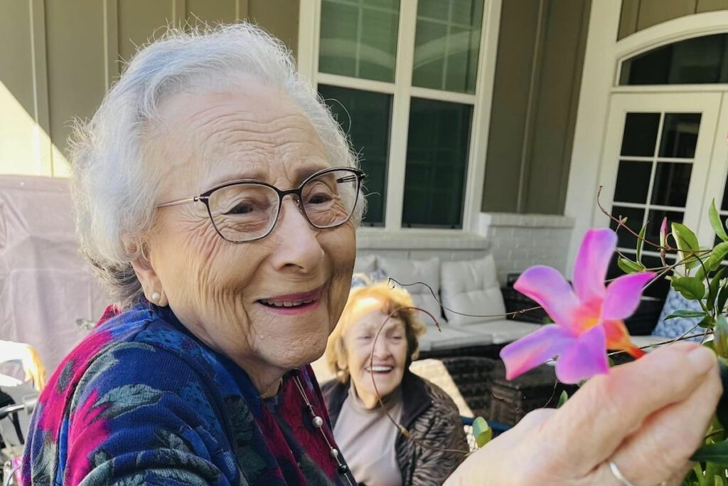 Sage Oak of Lake Charles | Resident picking flowers