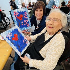 Sage Oak Lake Charles | Resident showing her painting